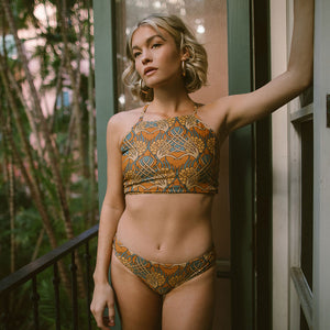 Model wearing Golden Hour Switchback Crop Bikini Top by Albion Fit