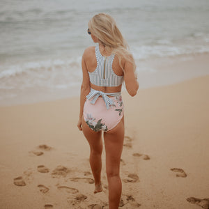 Woman on beach in one-piece monokini zipper tie in back